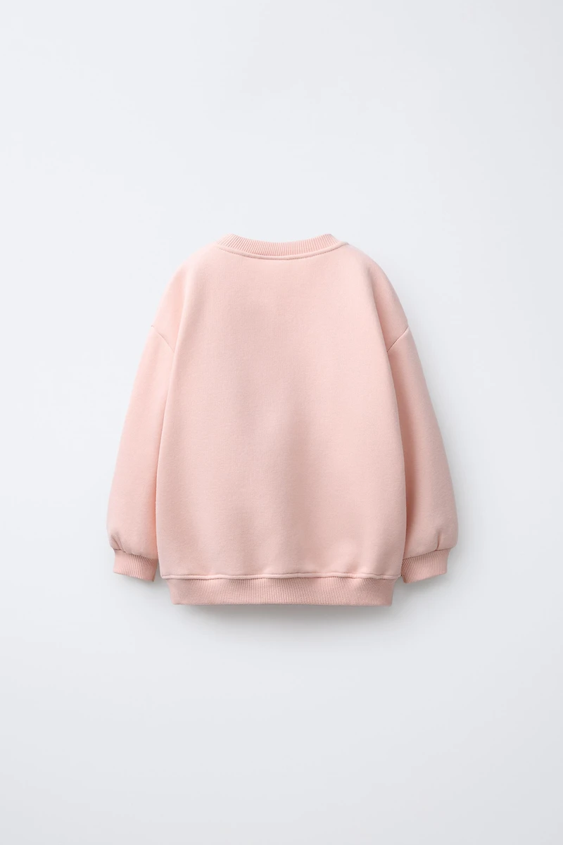 SWEAT À INSCRIPTION BRILLANTE