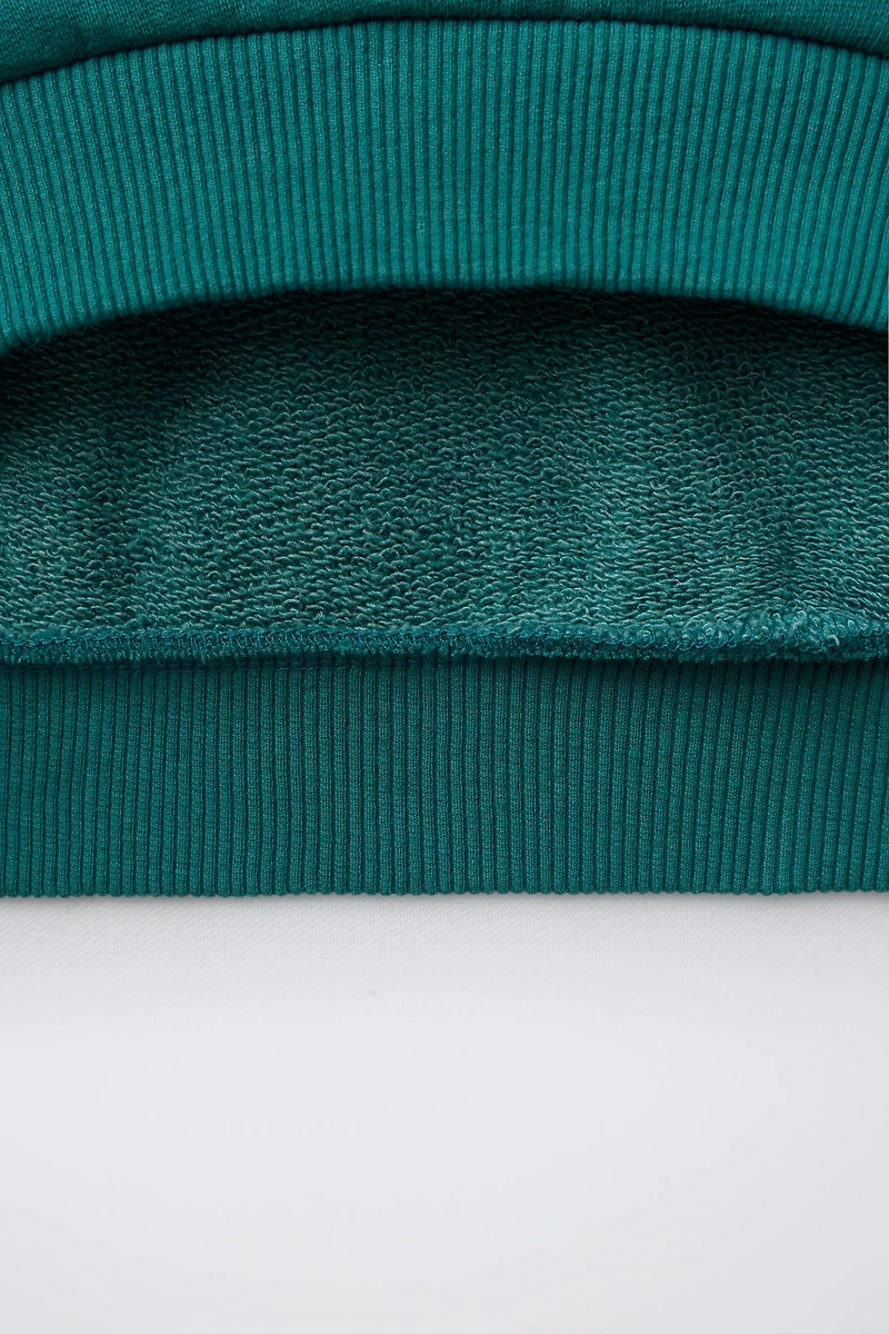 SWEAT À PIÈCE BRODÉE
