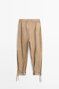 Suede leather pants with tie-detail hems