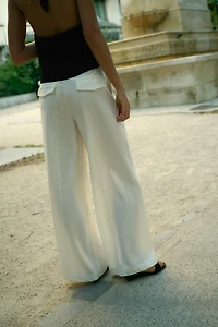 PLEATED PANTS WITH FLAPS