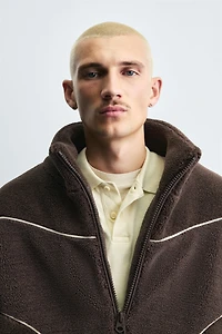 BLOUSON EFFET MOUTON À LISERÉS EN CONTRASTE