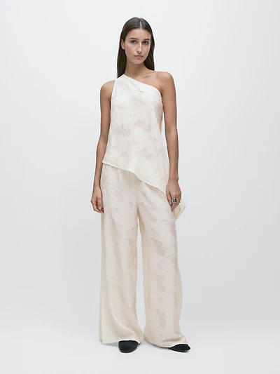 Top with asymmetric neckline