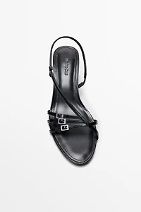 Leather heeled sandals with buckles