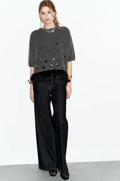 WOOL SWEATER WITH SEQUINS AND FEATHERS