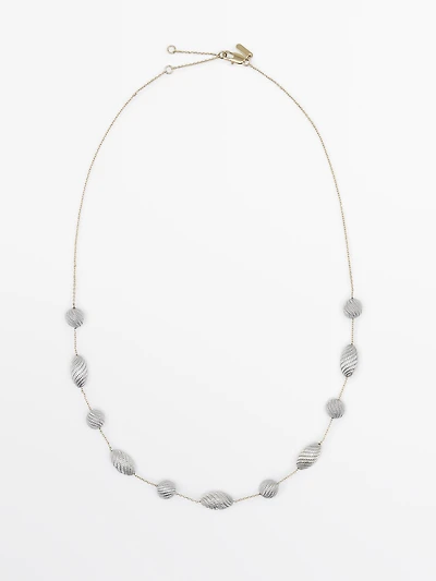 Necklace with textured oval pieces