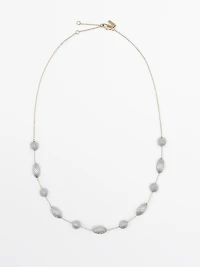 Necklace with textured oval pieces