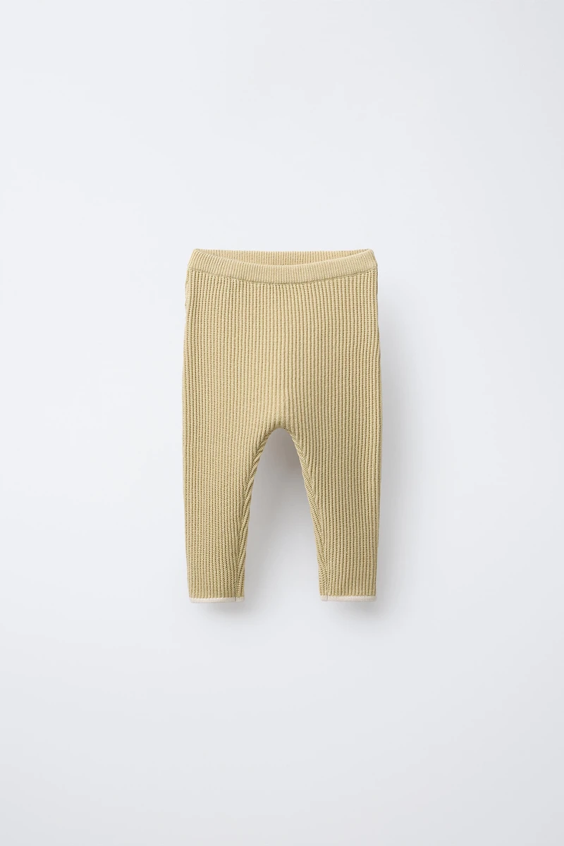 PANTS WITH CONTRASTING PIPING