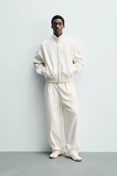 PLEATED WIDE FIT JOGGER PANTS