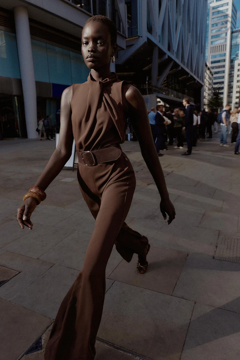SLEEVELESS BELTED JUMPSUIT