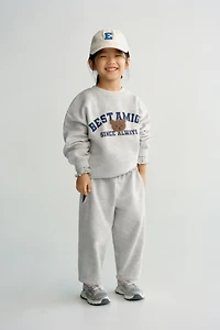 VARSITY TERRY PATCH APPLIQUÉ SWEATSHIRT
