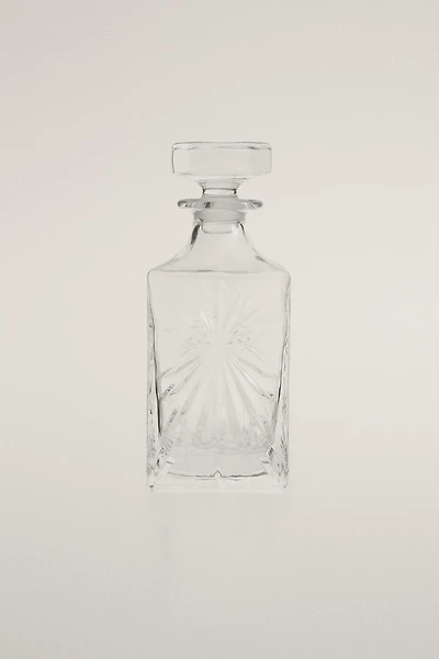 CRYSTALLINE BOTTLE WITH RAISED DESIGN