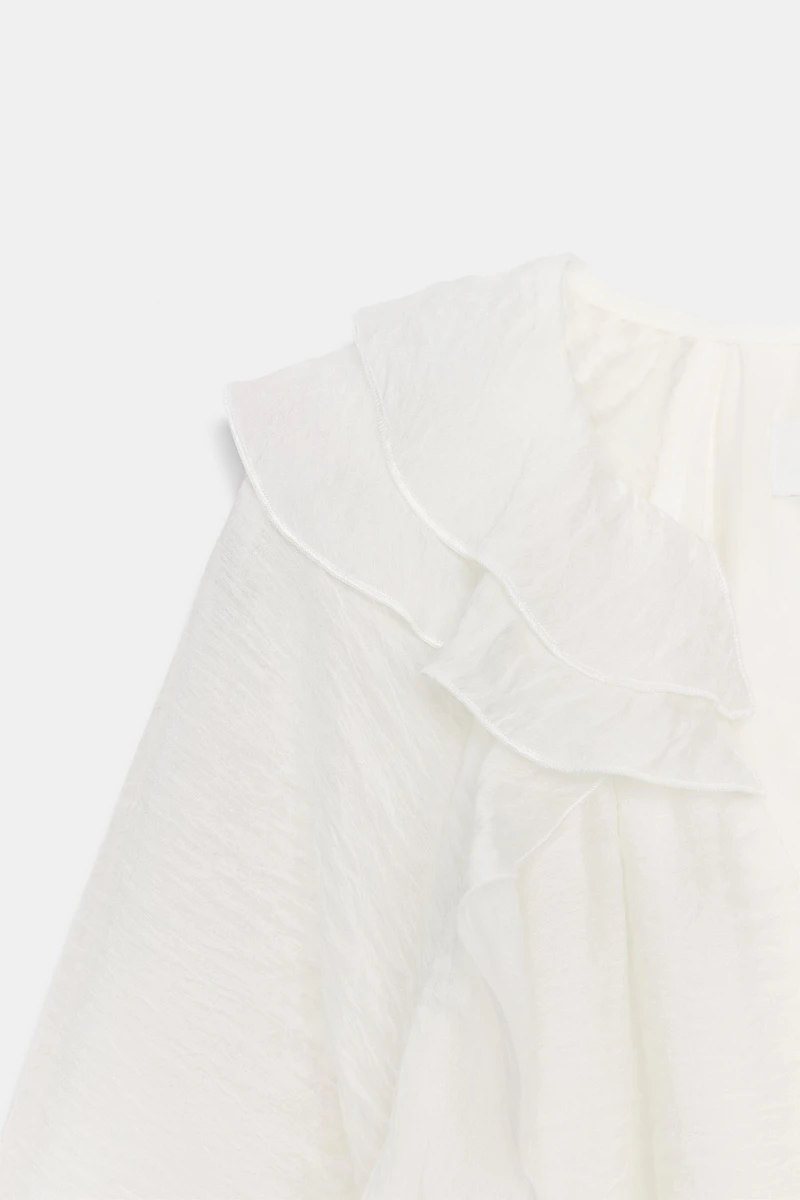 BLOUSE À VOLANTS ET PLIS