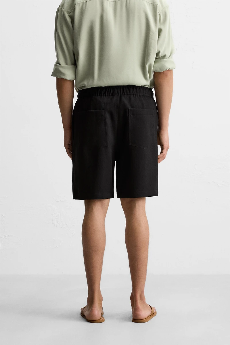 PLEATED FLOWY SHORTS