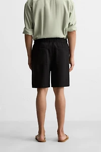 PLEATED FLOWY SHORTS