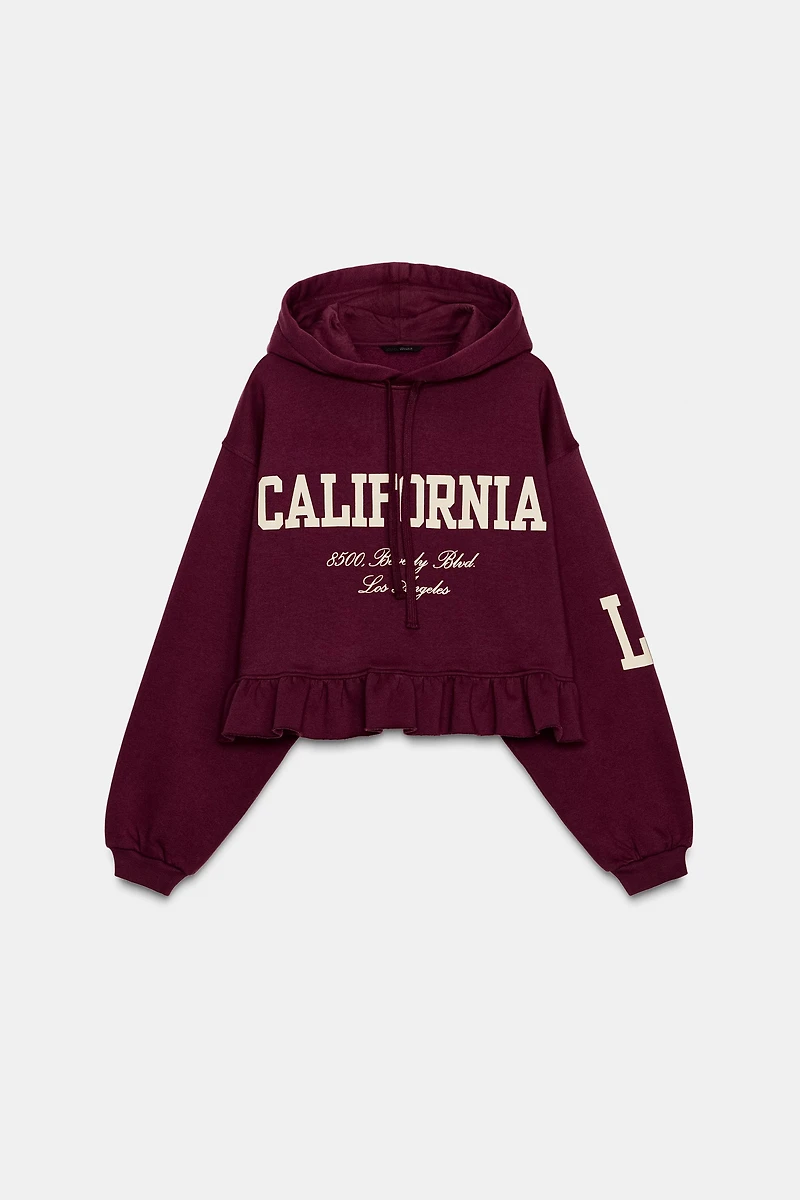 RUFFLED VARSITY SWEATSHIRT