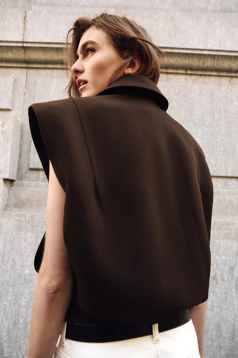 ELASTIC HEM SHOULDER PAD VEST
