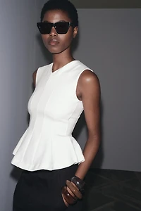 SLEEVELESS INTERLOCK PEPLUM TOP