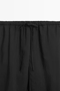 Double-layer pants with tie detail