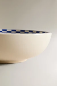 CERAMIC BOWL WITH A CHECKED DESIGN ON THE RIM