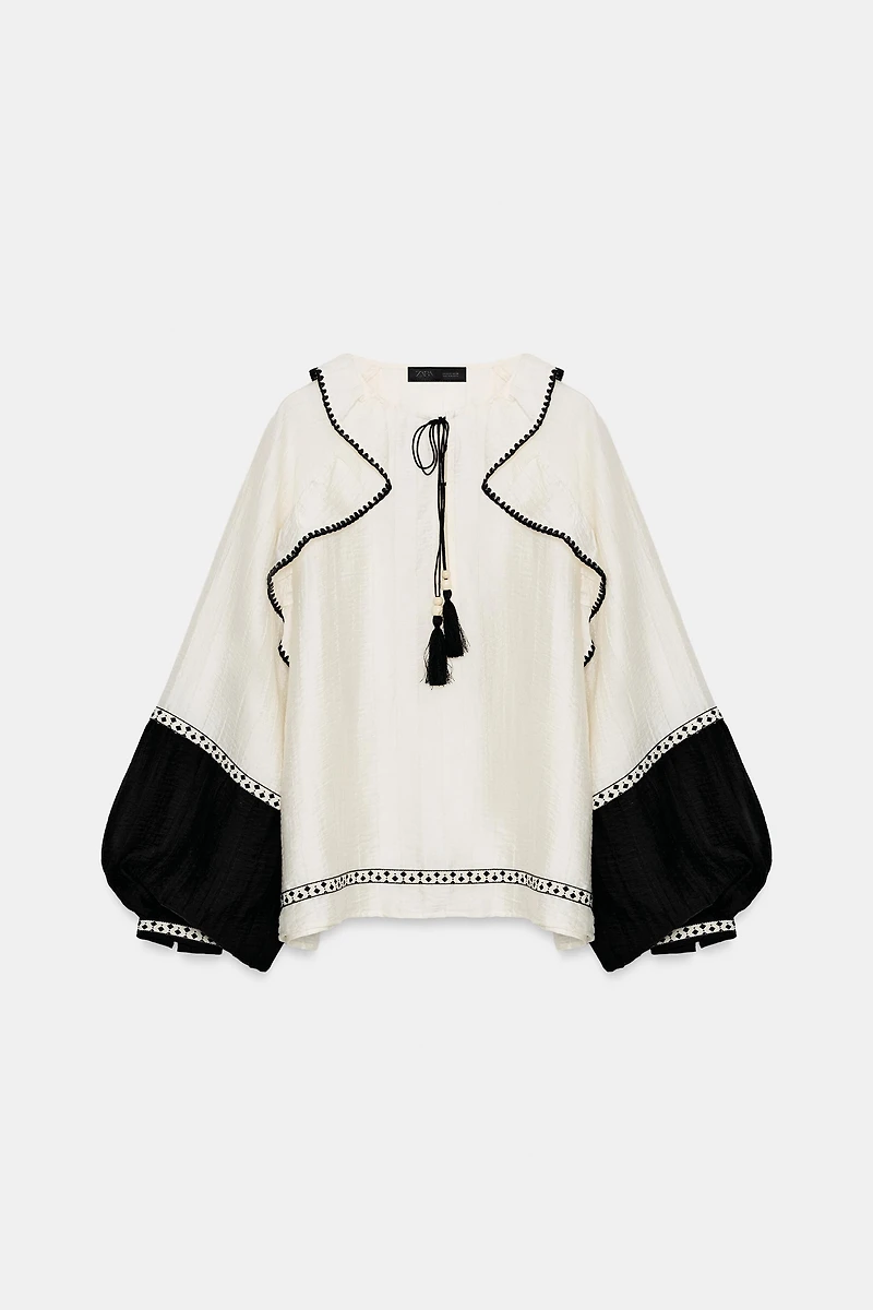 VOLUMINOUS RUFFLE BLOUSE