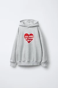 HEART PRINT SWEATSHIRT