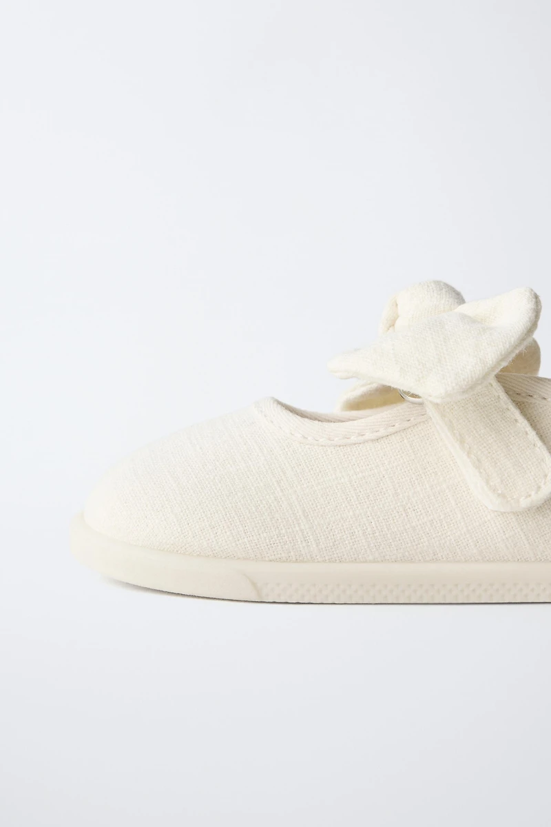 BAREFOOT BALLET FLATS WITH BOW