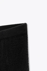 PANTALON EN MAILLE TEXTURÉE À FLEURS