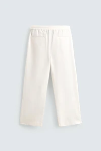 TEXTURED PLEATED PANTS