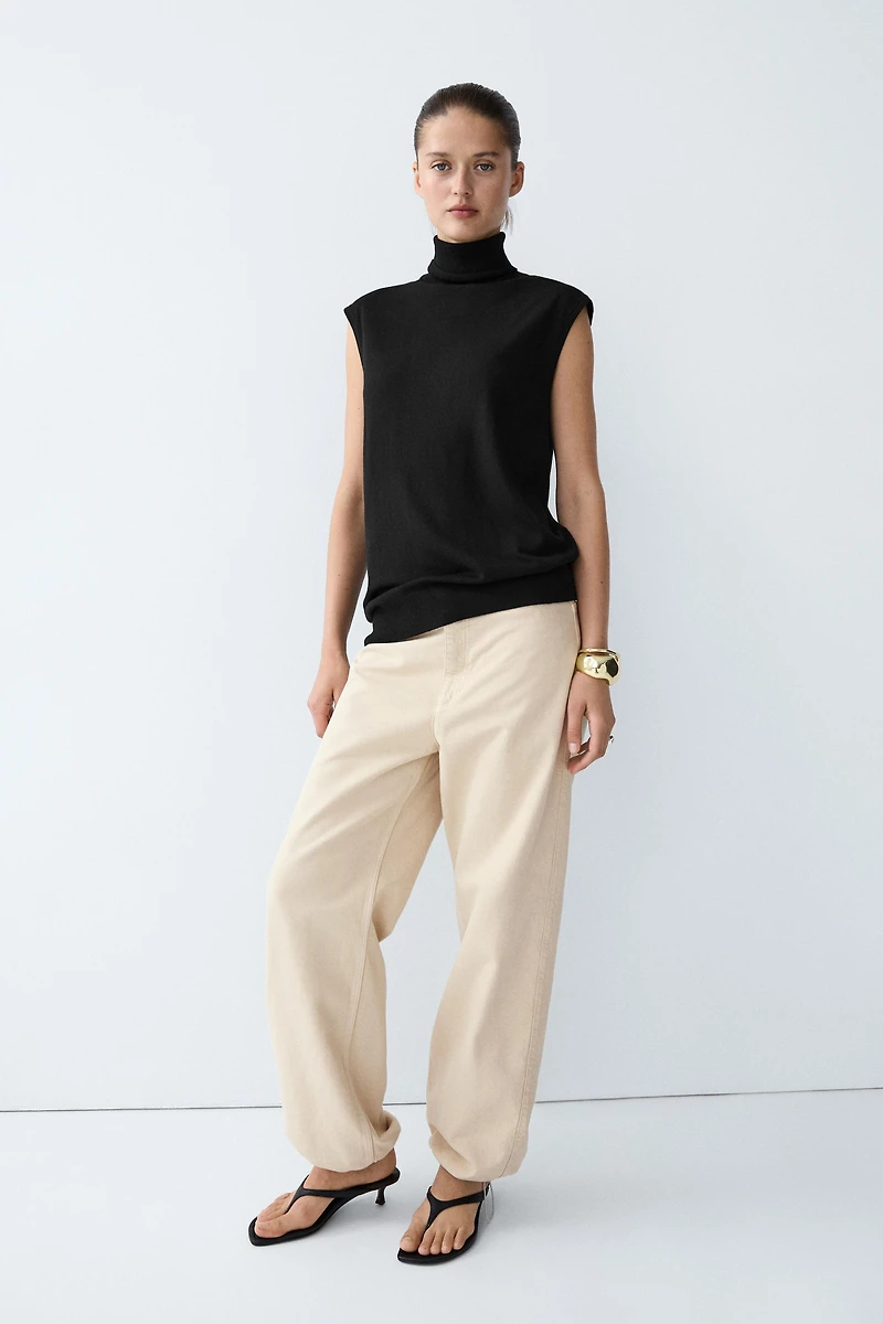 Asymmetric hem turtleneck top
