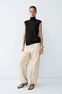 Asymmetric hem turtleneck top