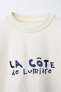 SWEAT À INSCRIPTION BRODÉE