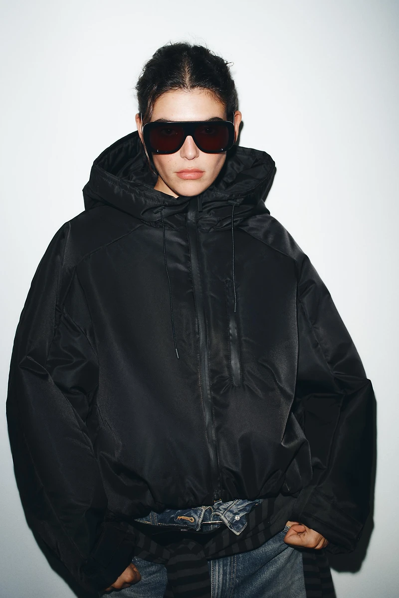 VESTE MATELASSÉE À CAPUCHE DÉPERLANTE ET COUPE-VENT