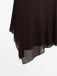 Cape en maille coupe asymétrique