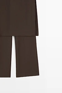 Flowing trousers with skirt detail