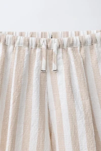PANTALON BALLON À PLIS ET RAYURES