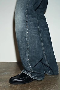 TRF SLUNG LOW-RISE STUDDED JEANS