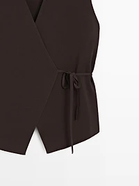 Crossover knit vest with tie detail
