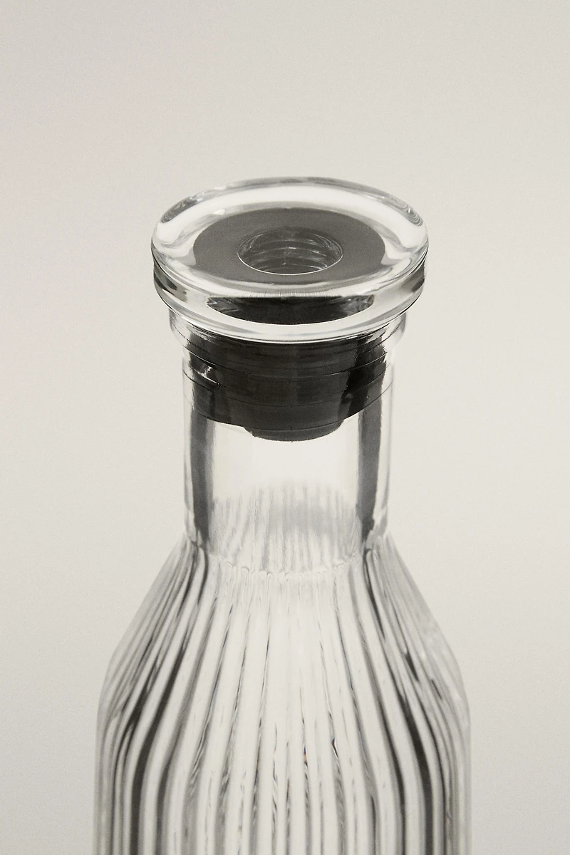 RAISED DESIGN GLASS BOTTLE