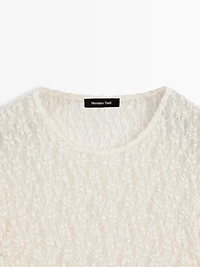 Openwork knit top with long sleeves and lace