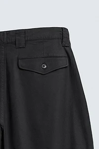 RELAXED FIT PLEATED PANTS