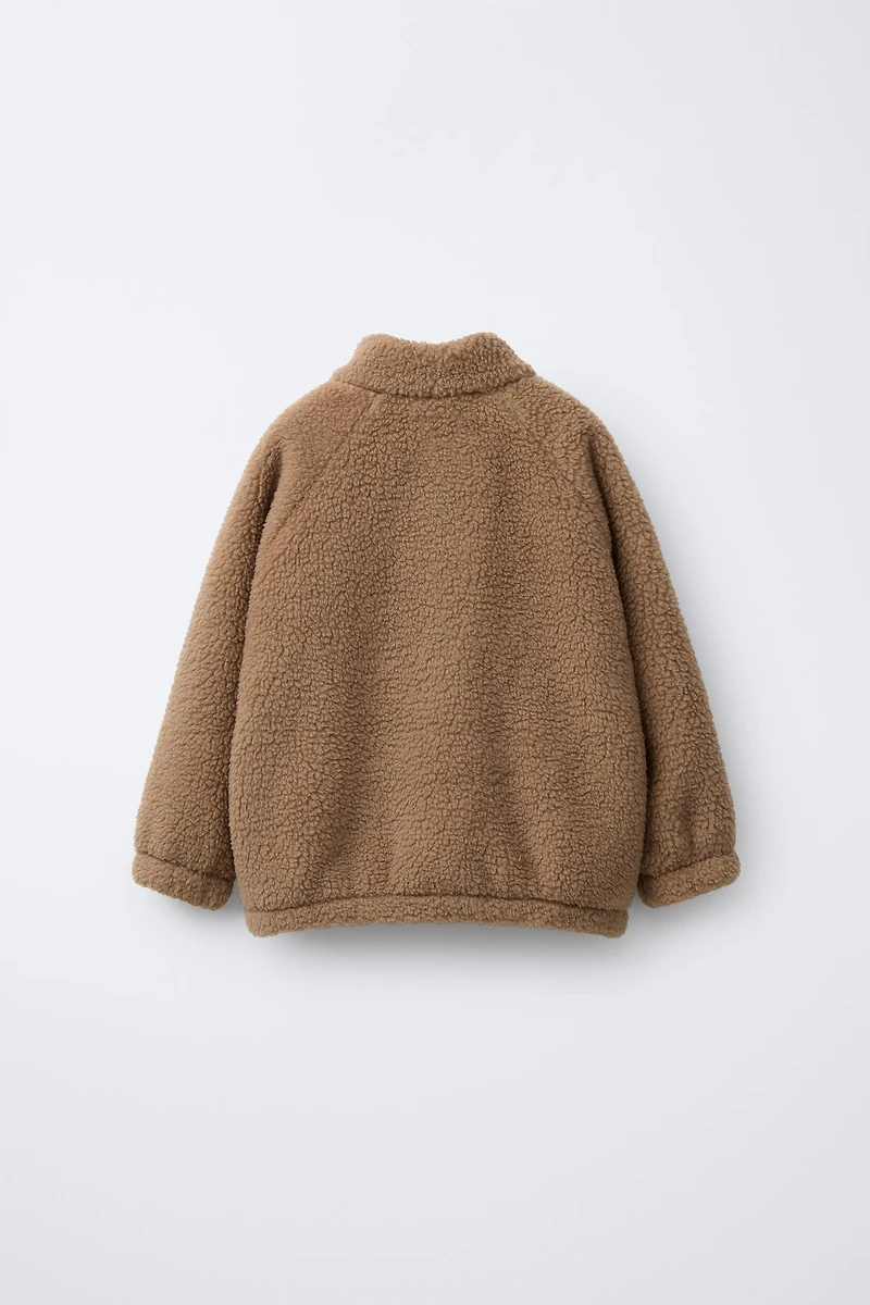 FAUX SHEARLING LABEL SWEATSHIRT