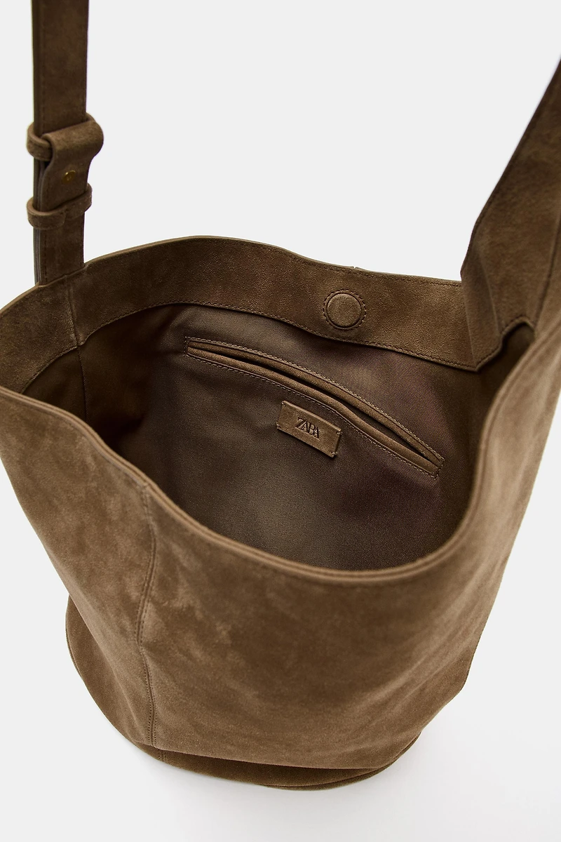 ASYMMETRIC LEATHER BUCKET BAG