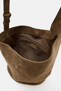 ASYMMETRIC LEATHER BUCKET BAG