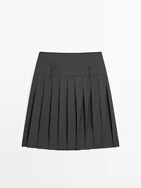 Jupe courte plissée taille large