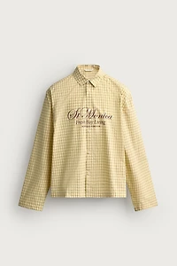 CHEMISE RELAXED FIT À CARREAUX ET INSCRIPTION IMPRIMÉE