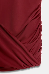 DRAPED SHOULDER PAD DRESS