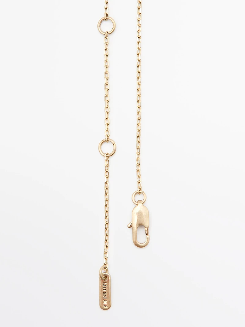 Necklace with metal pendant