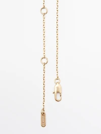 Necklace with metal pendant