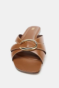 CROSSED SANDALS WITH METALLIC DETAIL