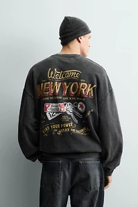 WASHED PRINTED TEXT SWEATSHIRT